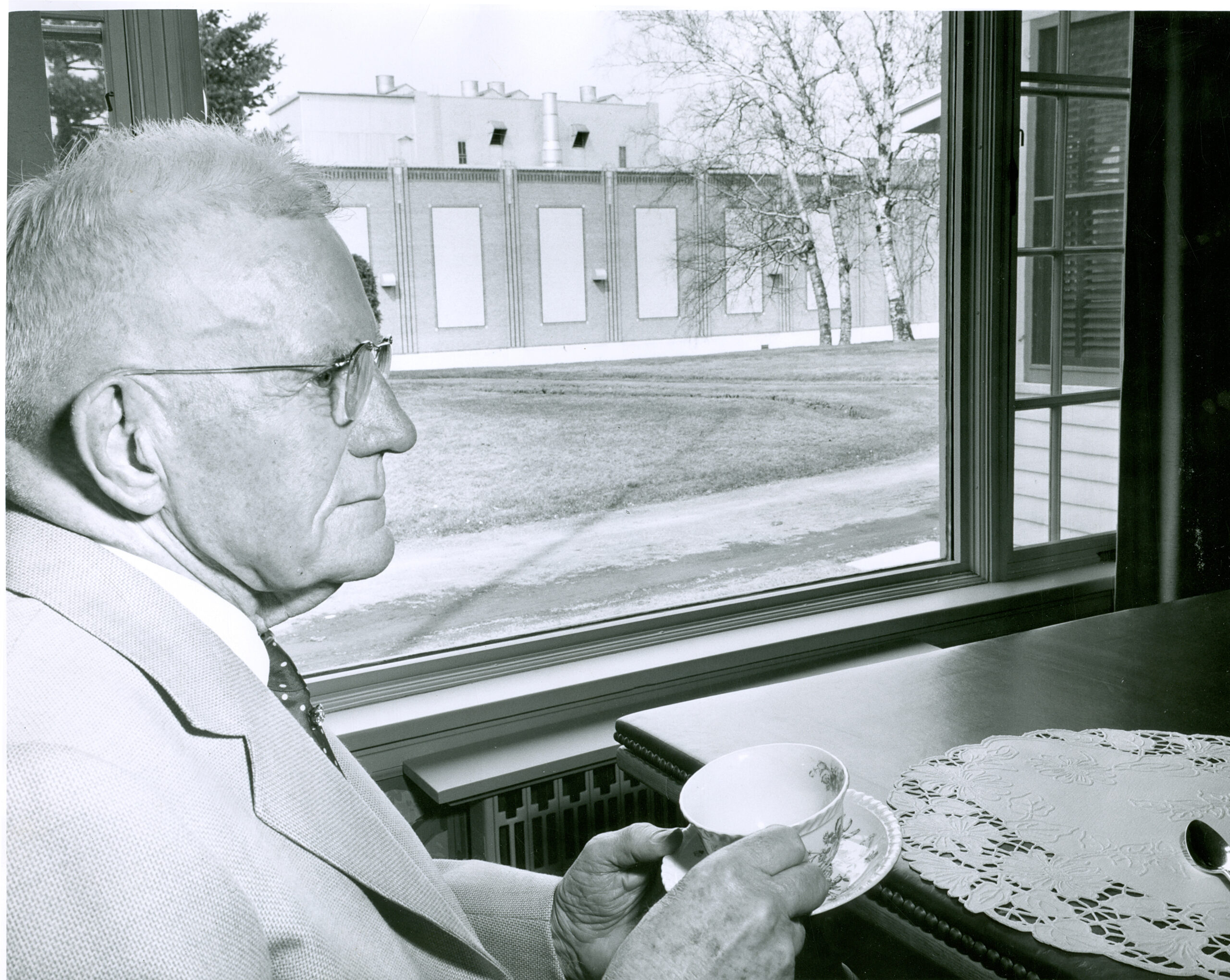 History-1950smaybe1957-ICHS2011.410.026CD42-mr_blandin_drinking_tea_at_home_mill_seen_through_window